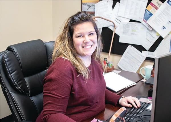 Young professional typing on her keyboard