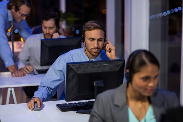 Business man answering a customer service call.