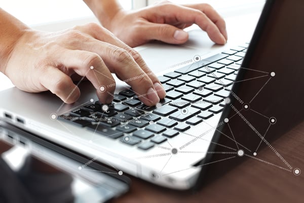 Close up of a business man launching malware onto his computer on accident.